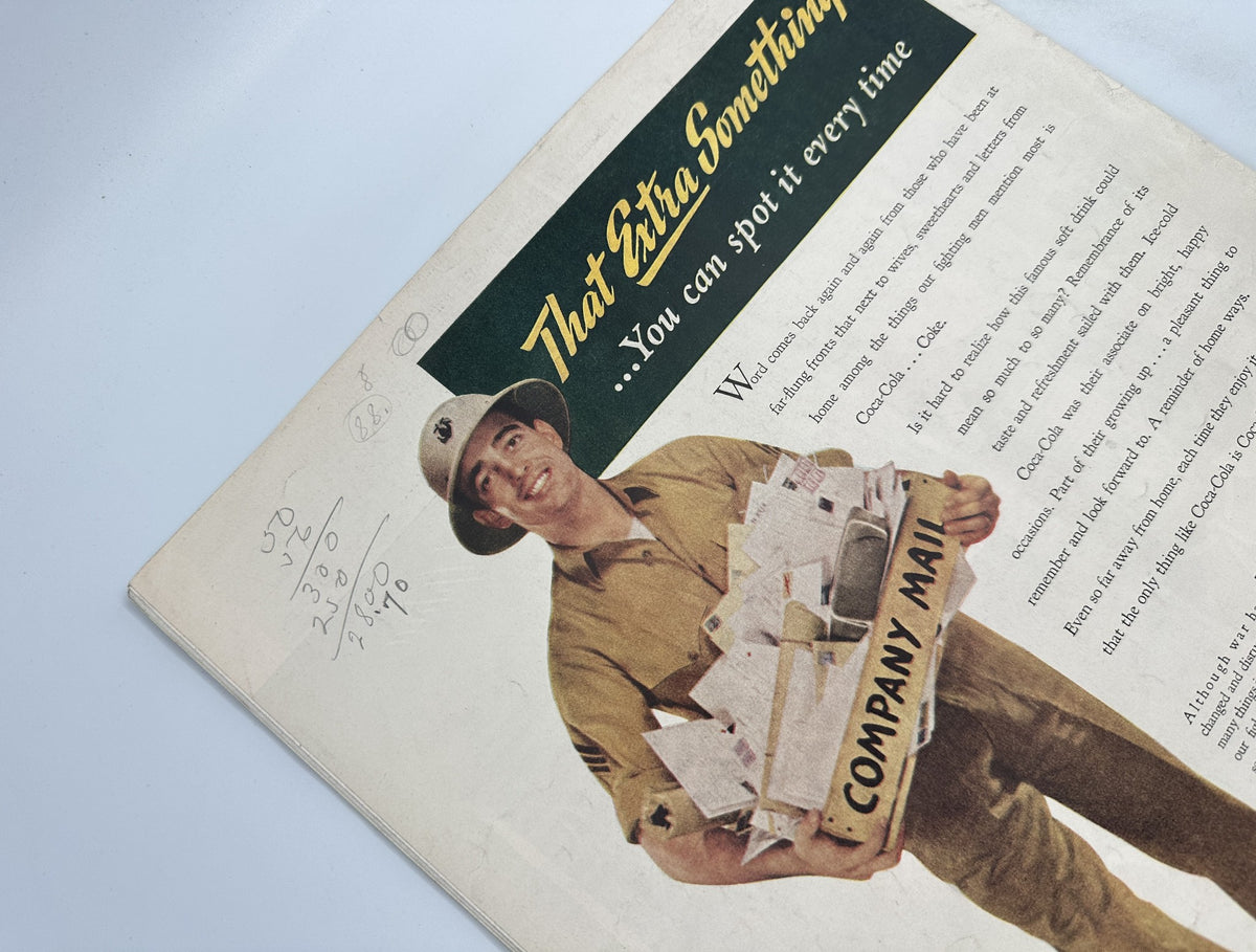 Vintage advertisement featuring a smiling soldier holding a box labeled 'COMPANY MAIL', promoting Coca-Cola with the slogan 'That Extra Something! ...You can spot it every time' - Collier’s Magazine July 31, 1943.