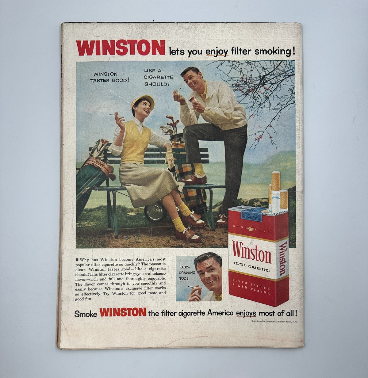 Vintage advertisement for Winston cigarettes featured in LIFE Magazine June 25, 1956, showcasing a couple enjoying smoking filtered cigarettes in a park setting.
