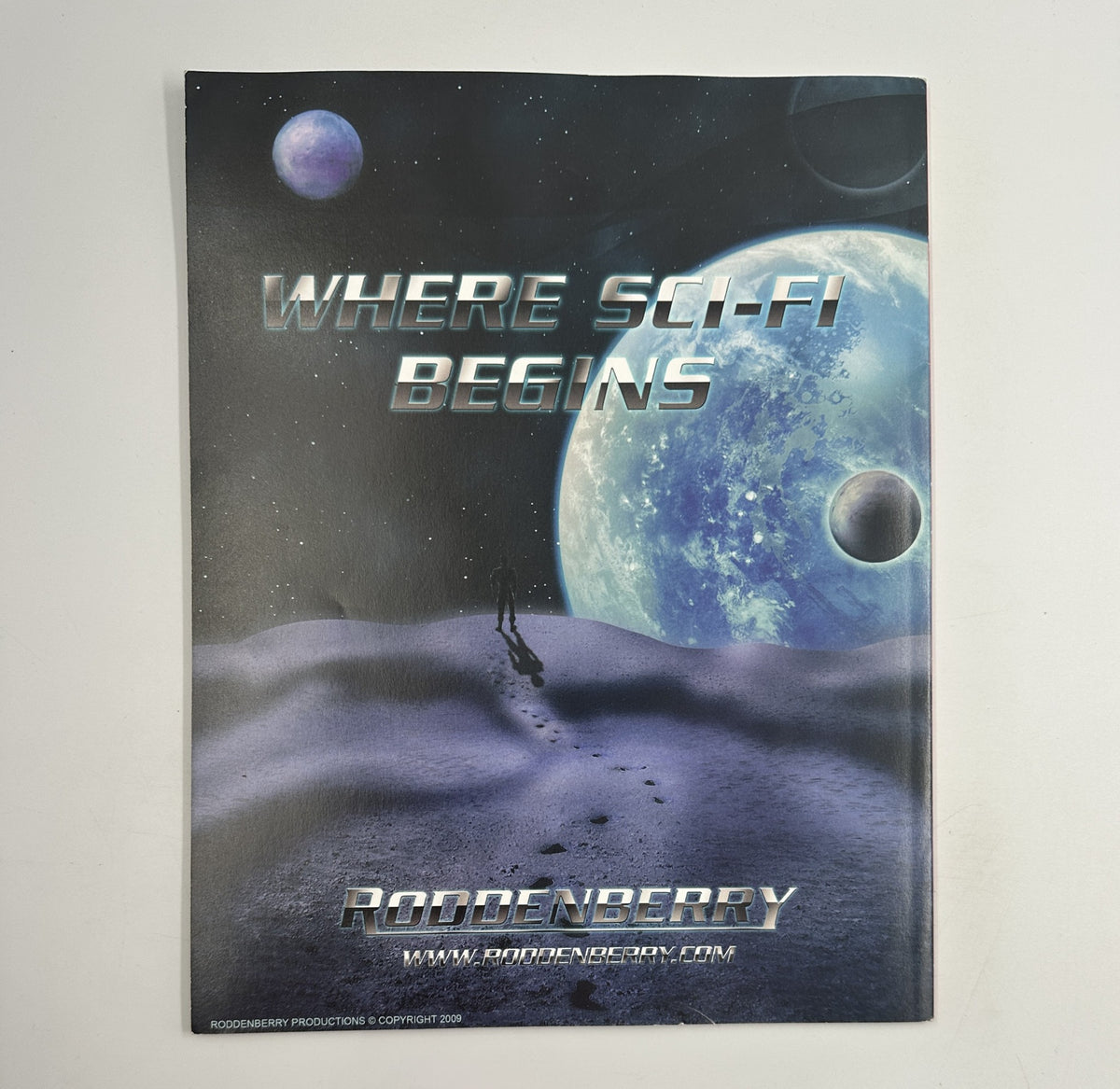Back cover of Geek Magazine March 2009 showcasing a sci-fi design with the text 'Where Sci-Fi Begins,' indicating the magazine's themes and focus on science fiction.