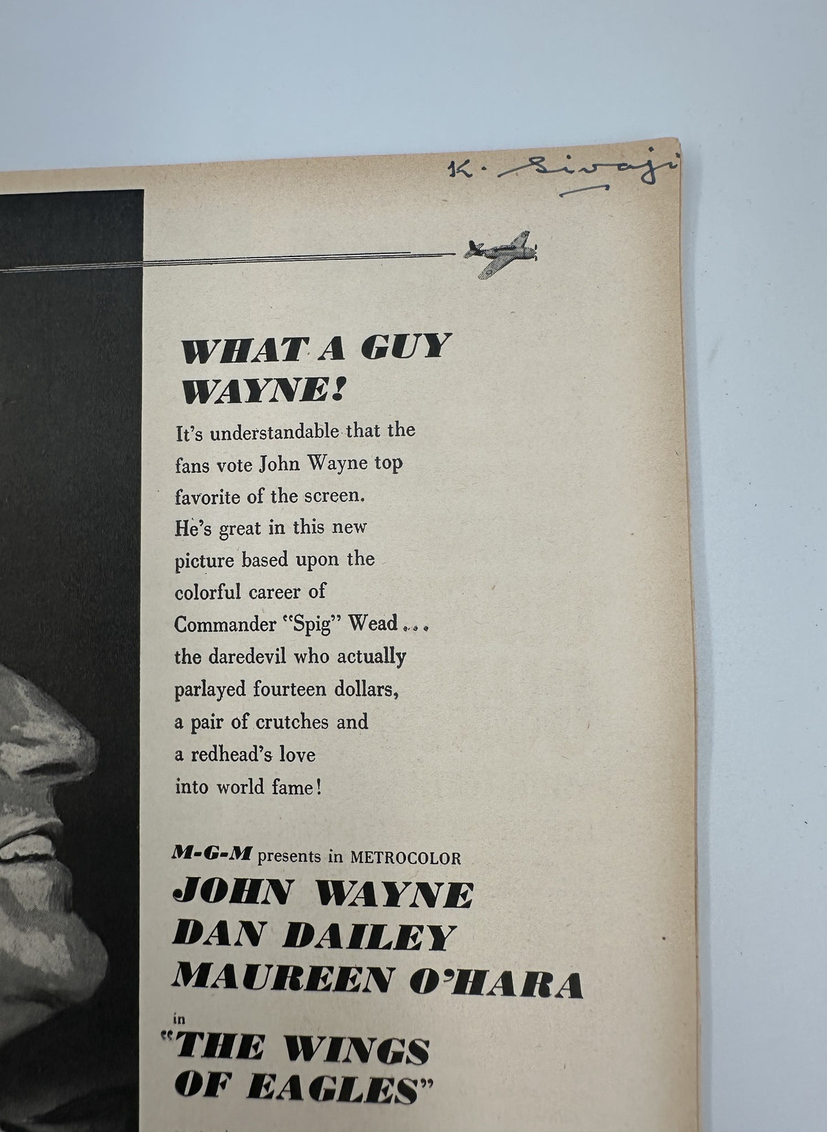 Close-up of a feature article in Photoplay Magazine March 1957 titled 'What a Guy Wayne!' showcasing John Wayne's career.