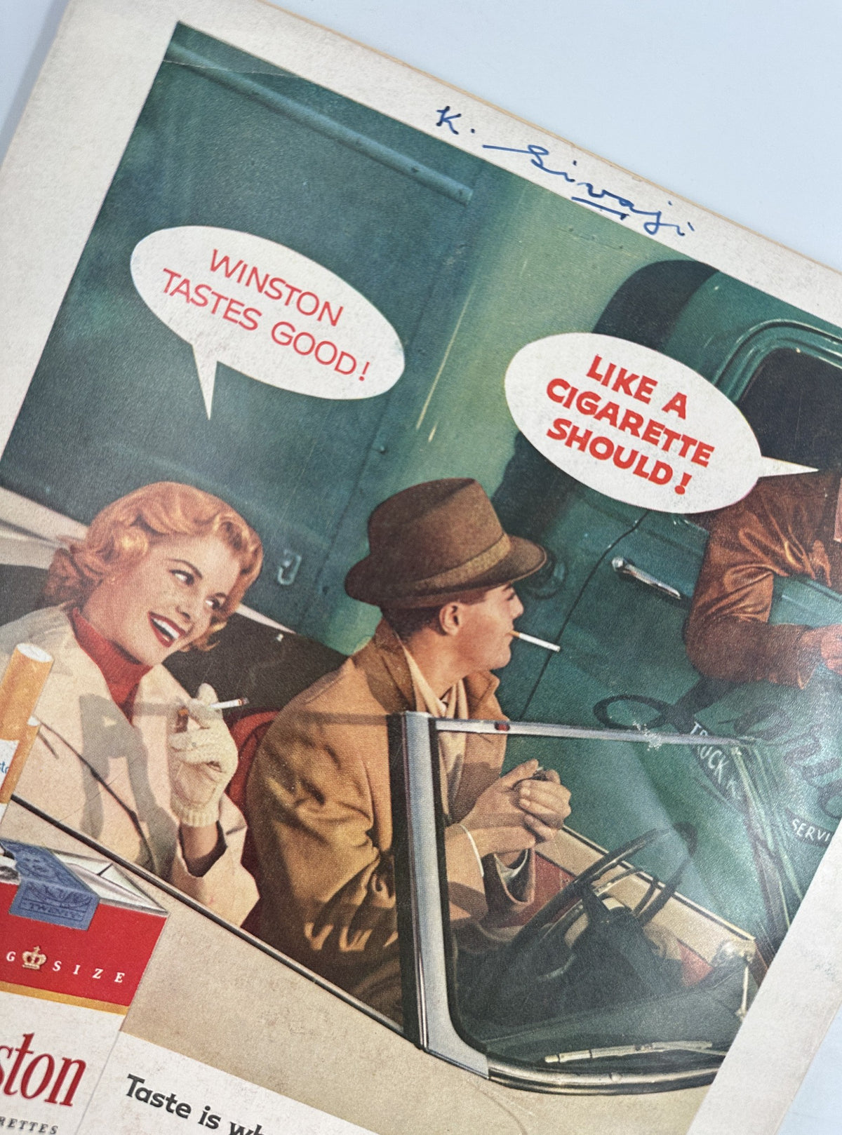 Photoplay Magazine March 1957 displaying a vintage advertisement for Winston cigarettes, featuring a fashionable couple enjoying a leisurely moment, promoting the smoking lifestyle.