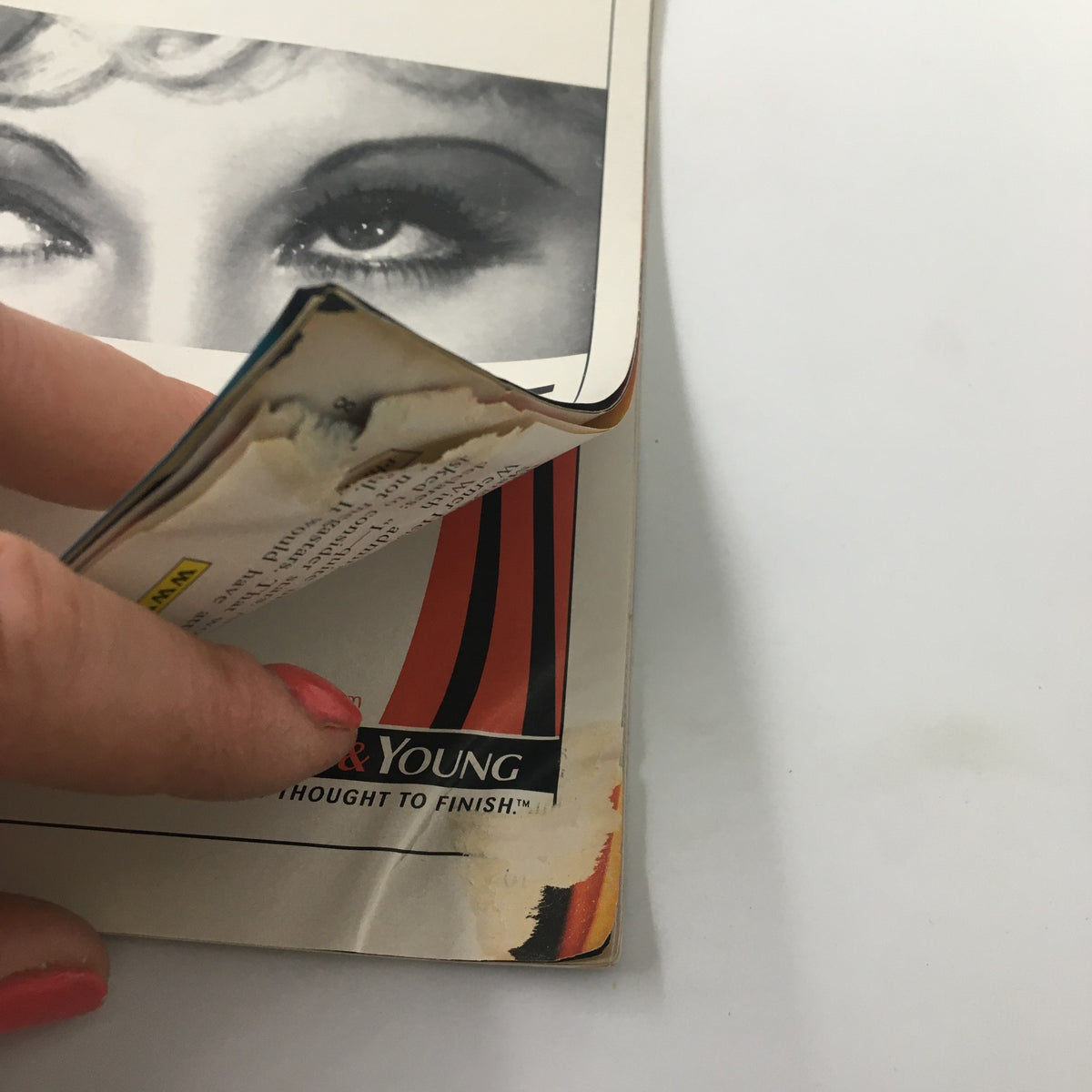 Close-up of the edge of the 2000 Playbill for 'Dirty Blonde' at the Helen Hayes Theatre, showing minor wear and tear indicative of its history.