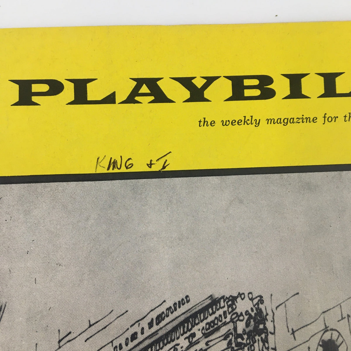 Cover of the 1963 Playbill titled 'The King and I' featuring a yellow header and handwritten notes.