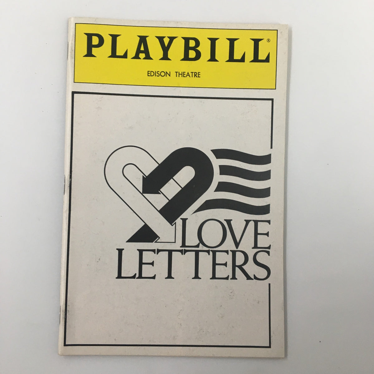 1990 Playbill Edison Theatre featuring Love Letters, showcasing a vintage design with a heart and striped pattern, a collectible item for theater enthusiasts.