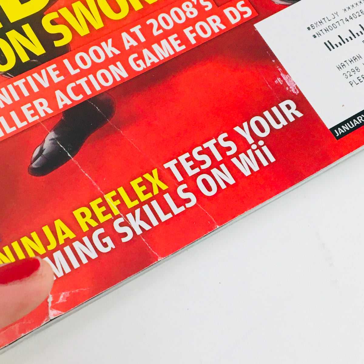 Close-up of the spine of Nintendo Power Magazine January 2008, illustrating the title Ninja Reflex and indicating it's designed to showcase gaming skills on Wii, with signs of age on the magazine.