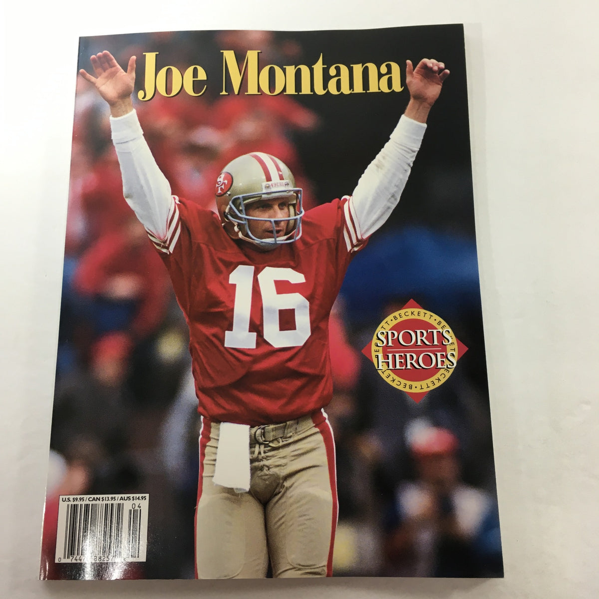 Beckett Sports Heroes: 1999 - Joe Montana San Francisco 49ers magazine cover featuring Joe Montana celebrating in a red and gold 49ers jersey with arms raised.