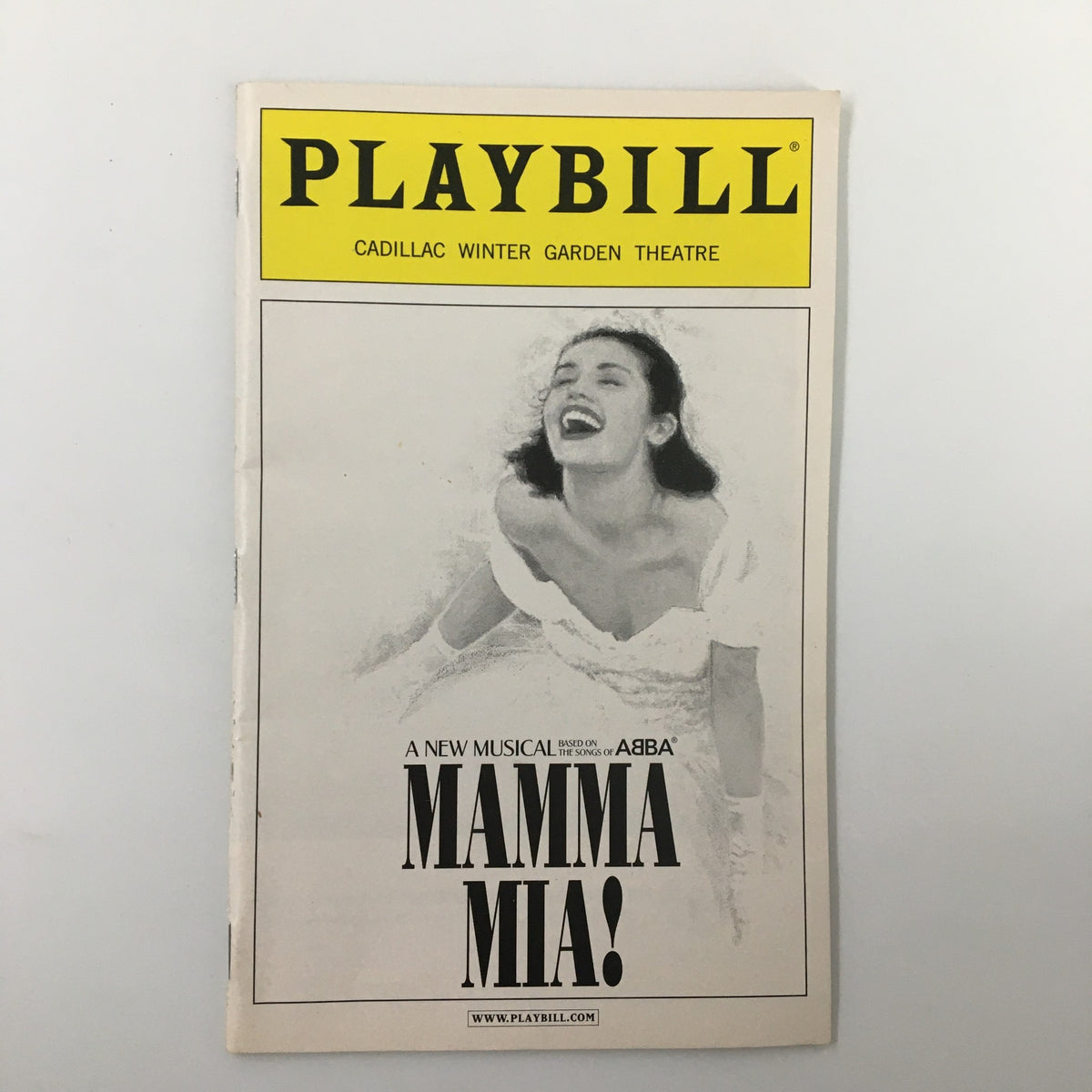 Cover of the 2003 Playbill for Mamma Mia! at Cadillac Winter Garden Theatre, featuring a woman joyfully singing.