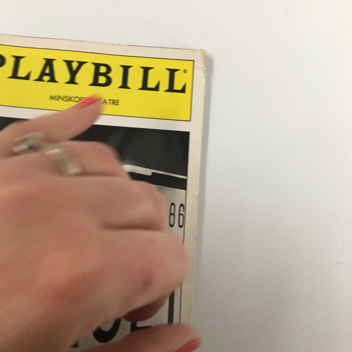 Close-up of the 1995 Playbill from Minskoff Theatre for 'Sunset Blvd.,' showing a hand holding the playbill.