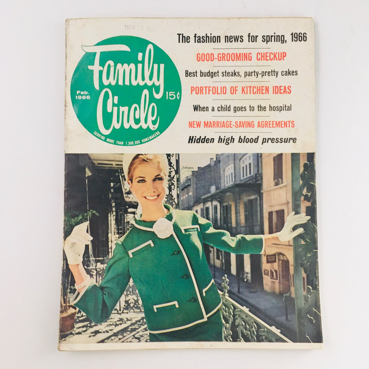 Family Circle Magazine February 1966 cover featuring a model in a green vintage outfit, highlighting a Portfolio of Kitchen Ideas. The magazine showcases mid-century design and includes various articles related to fashion and home improvement.