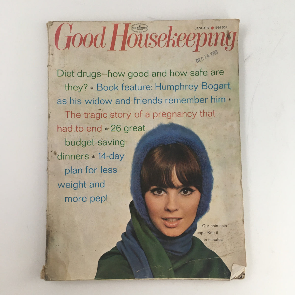 Cover of Good Housekeeping Magazine January 1966 featuring a woman in a blue hat and scarf, showcasing the topic of 24 budget-saving dinners and a feature on Humphrey Bogart.