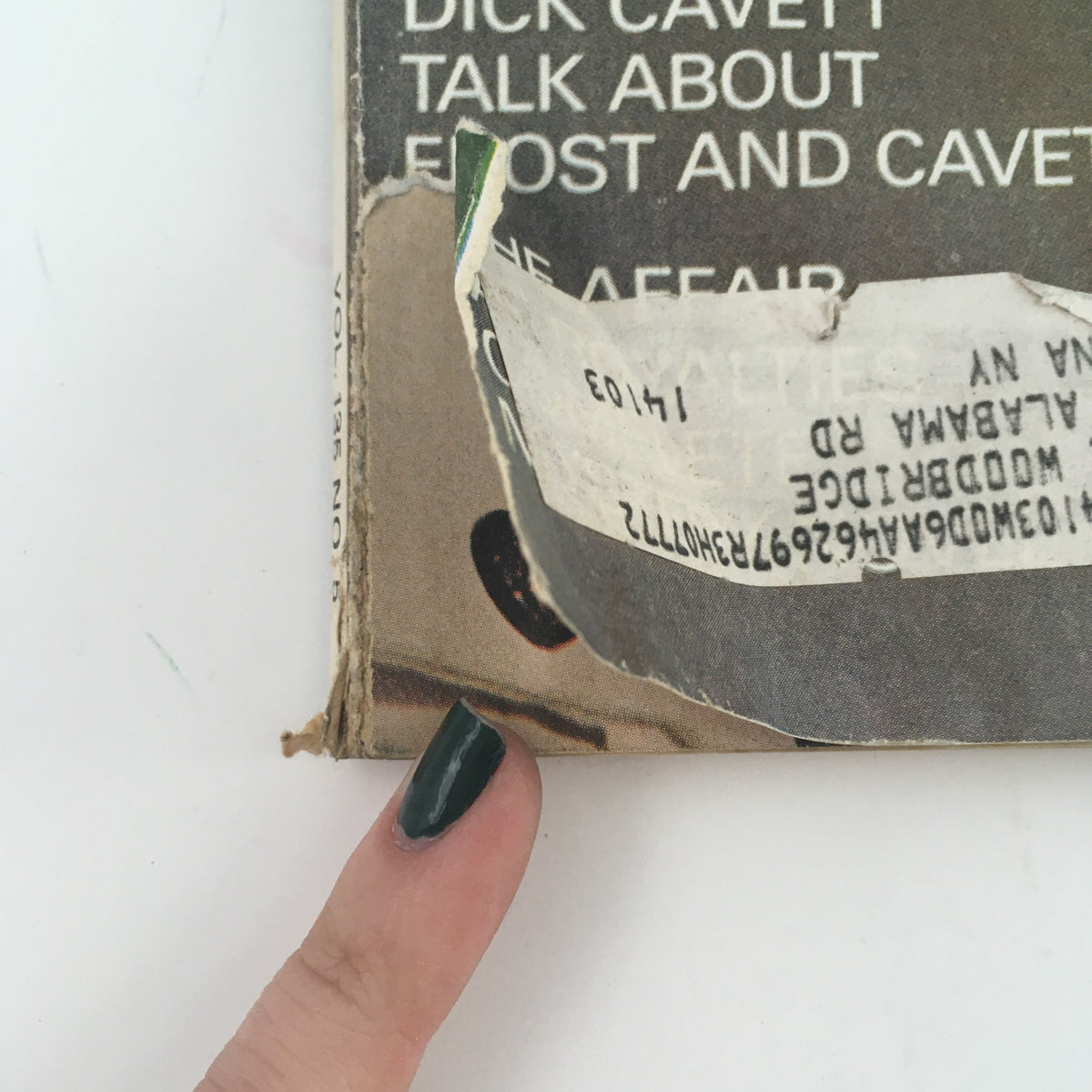 Close-up of the side binding of Redbook Magazine September 1970, showing an address label and wear, emphasizing the vintage condition of the magazine.