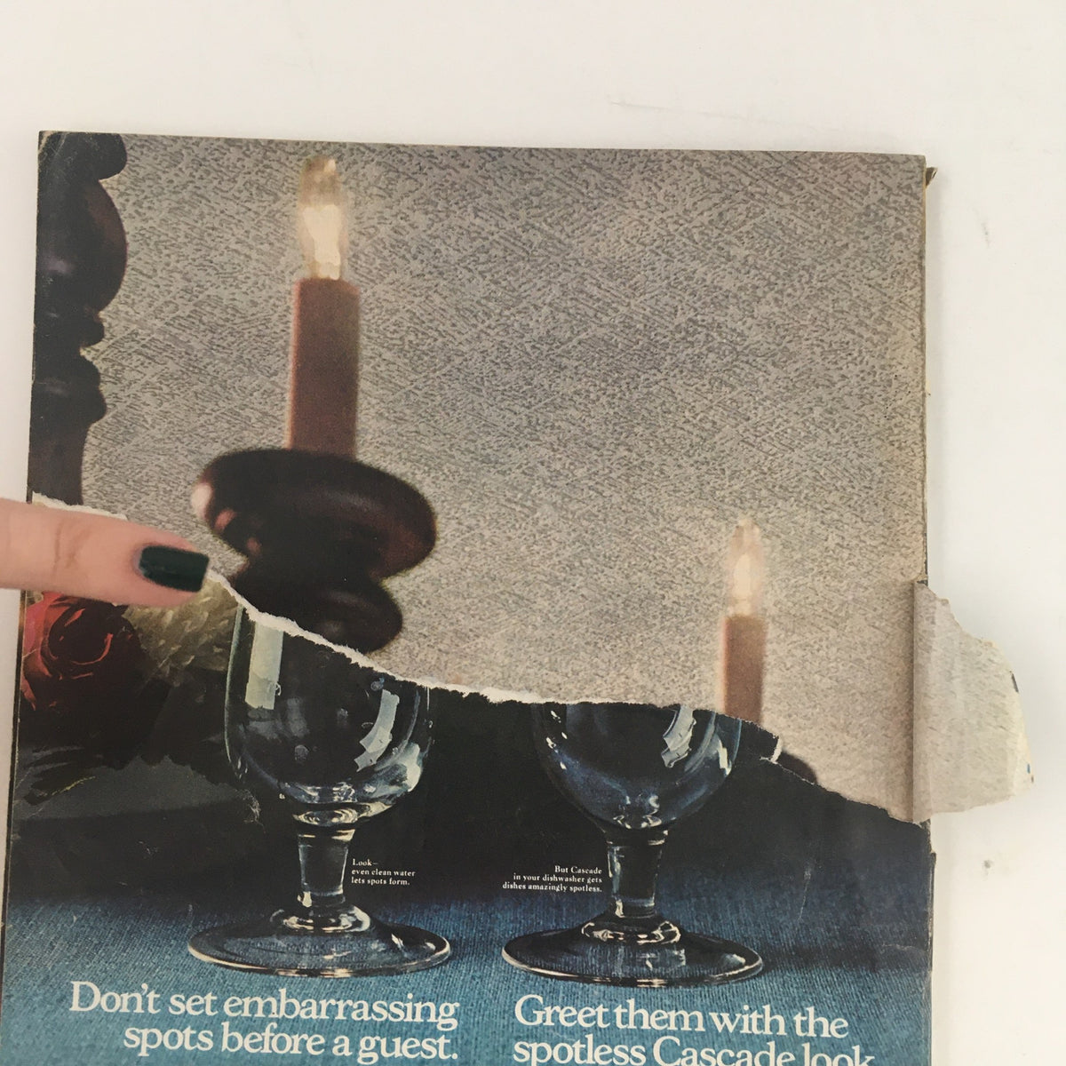 Close-up of a vintage magazine cover from Redbook Magazine September 1970, featuring candlelight and glassware, with a tear on the edge. Highlights the charm of classic design from the era.