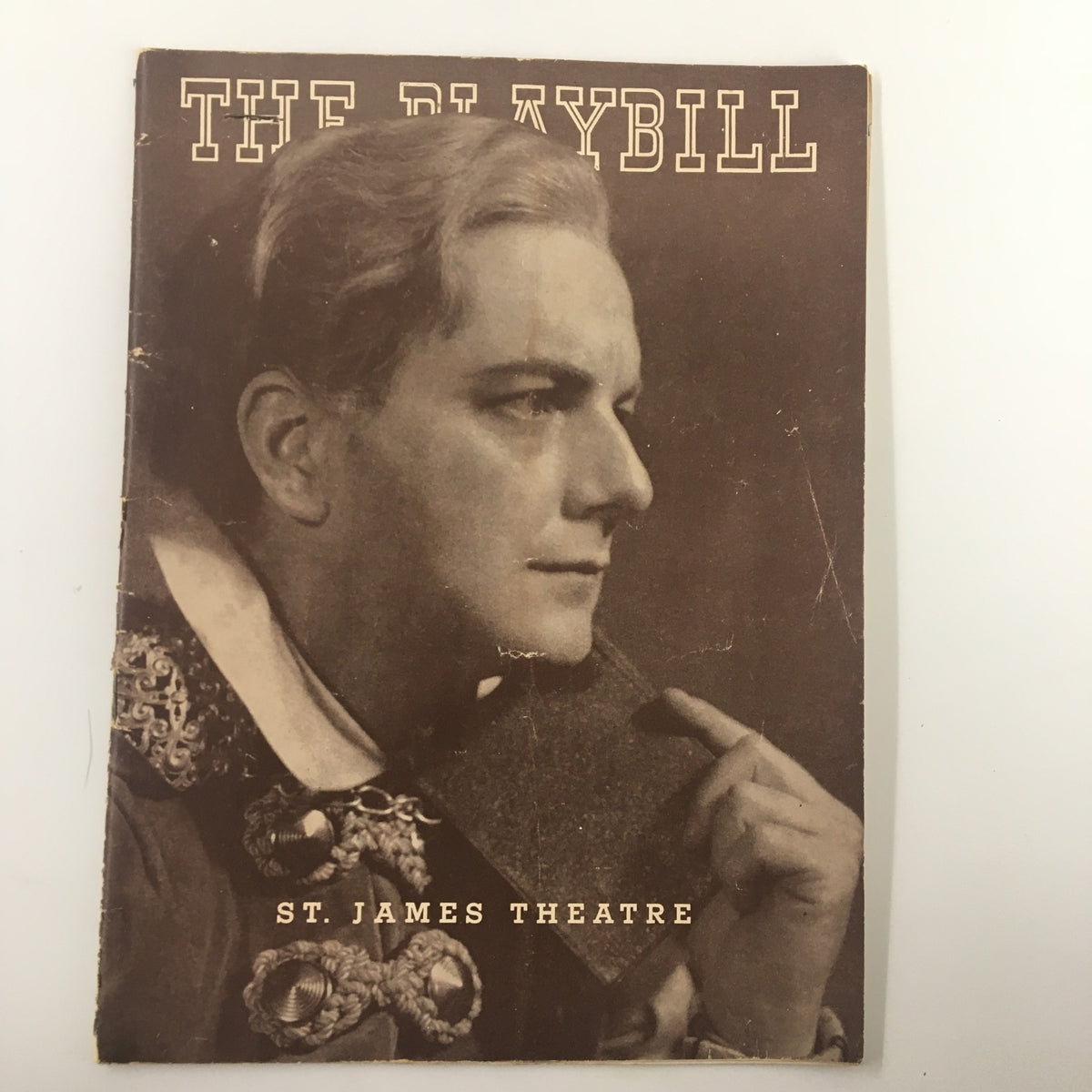 1938 Playbill from St. James Theatre featuring Maurice Evans in Hamlet. The cover depicts a side profile of a male actor with styled hair and a theatrical costume, highlighting the historical significance of this vintage magazine.