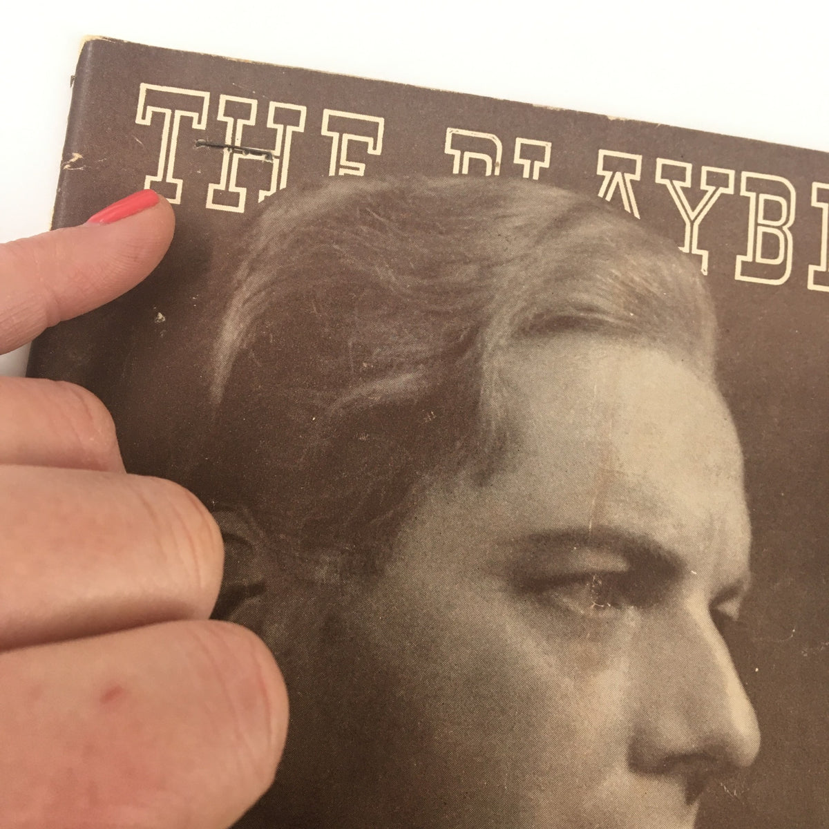 Close-up of the 1938 Playbill from St. James Theatre showcasing the title 'THE PLAYBILL' above Maurice Evans' image, capturing intricate details of this collectible theatre memorabilia.