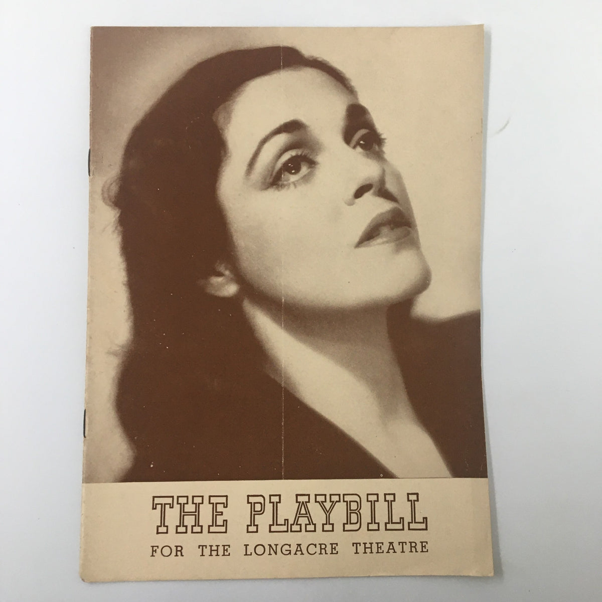 Cover of the 1941 Playbill for the Longacre Theatre featuring Helen Craig in Johnny Belinda, showcasing a vintage photograph of Helen Craig with her head tilted, capturing a moment of theatrical elegance.