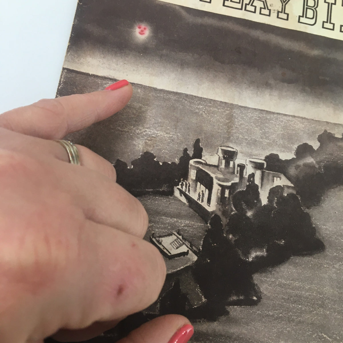 Close-up view of the 1937 Playbill from the National Theatre, highlighting details of the cover design of Angel Island by Bernie Angus.