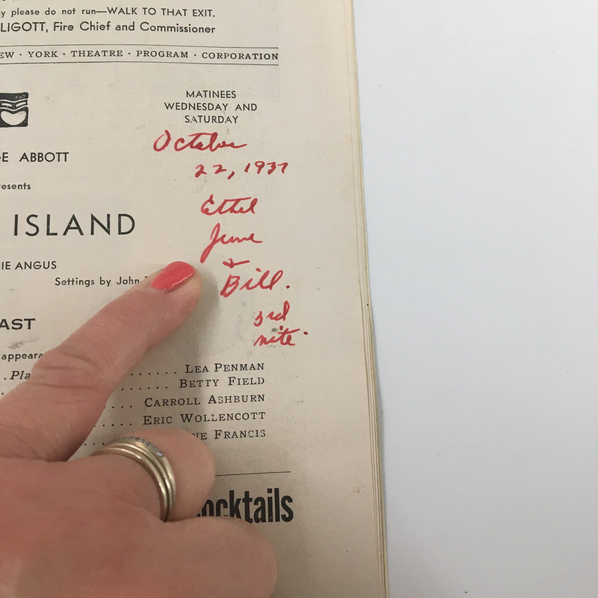 Close-up of the 1937 Playbill from the National Theatre, highlighting notes and dates written in red ink, capturing the personal history of the 'Angel Island' performance.