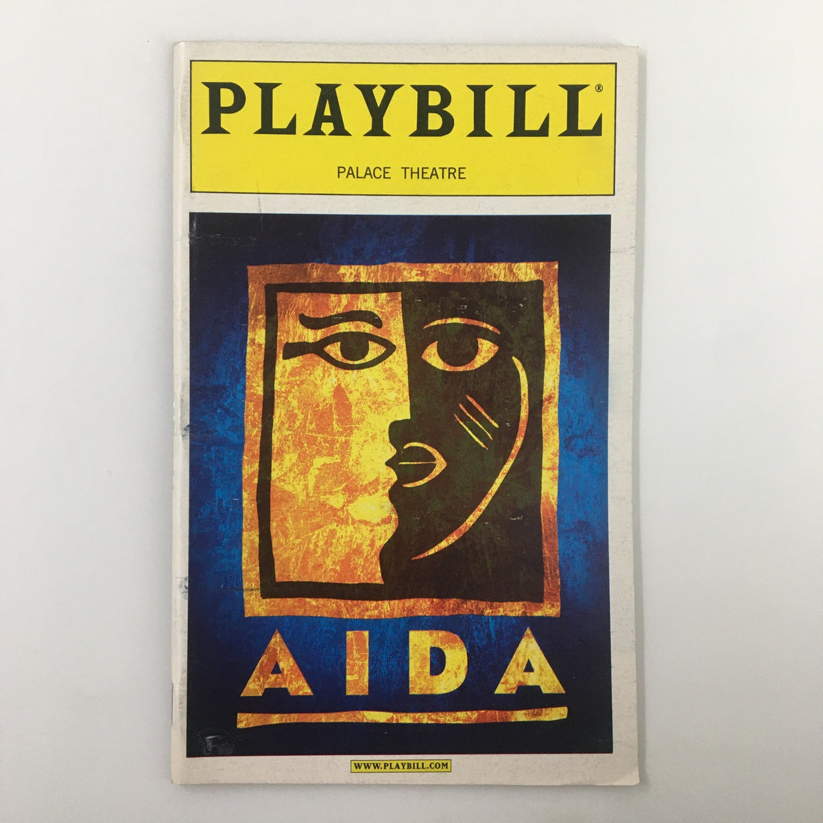 2001 Playbill for Aida at the Palace Theatre, featuring a striking design with the word 'AIDA' and a theatrical mask illustration.