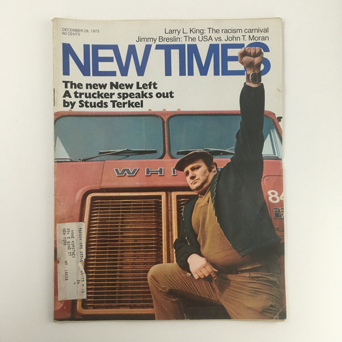 Cover of New Times Magazine from December 28, 1973, featuring a man standing triumphantly in front of a truck with the title 'NEW TIMES'. The magazine includes articles by renowned writers Larry L. King, Jimmy Breslin, and John T. Moran.