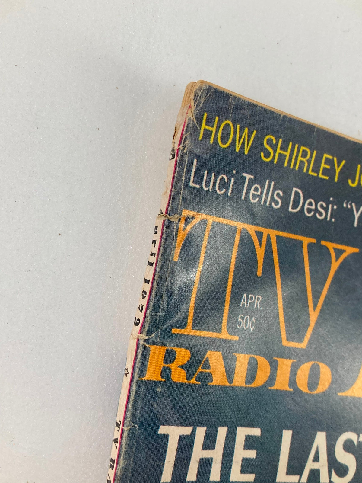 Close-up of the top spine of VTG TV Radio Mirror Magazine April 1971, showing wear and age, indicative of its vintage status.