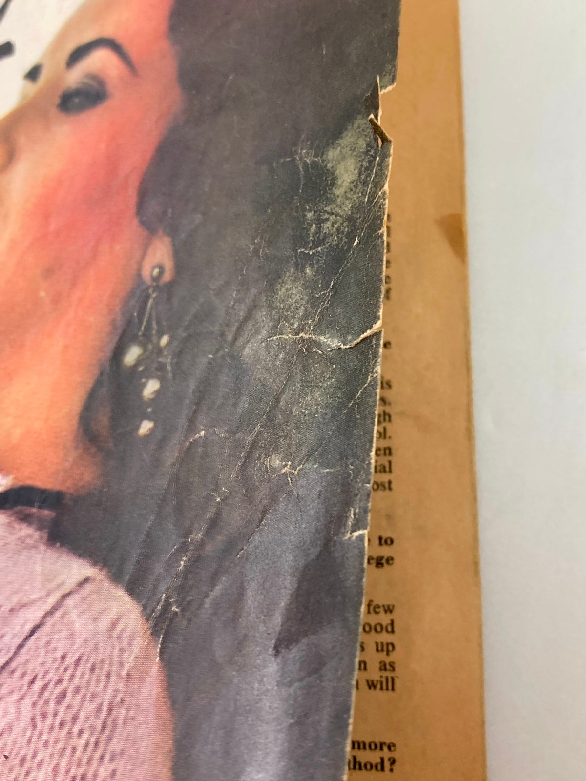 Side view of the cover of the Vintage Movie Mirror Magazine September 1965 Vol 9 #11, displaying some wear and tear along the edges.
