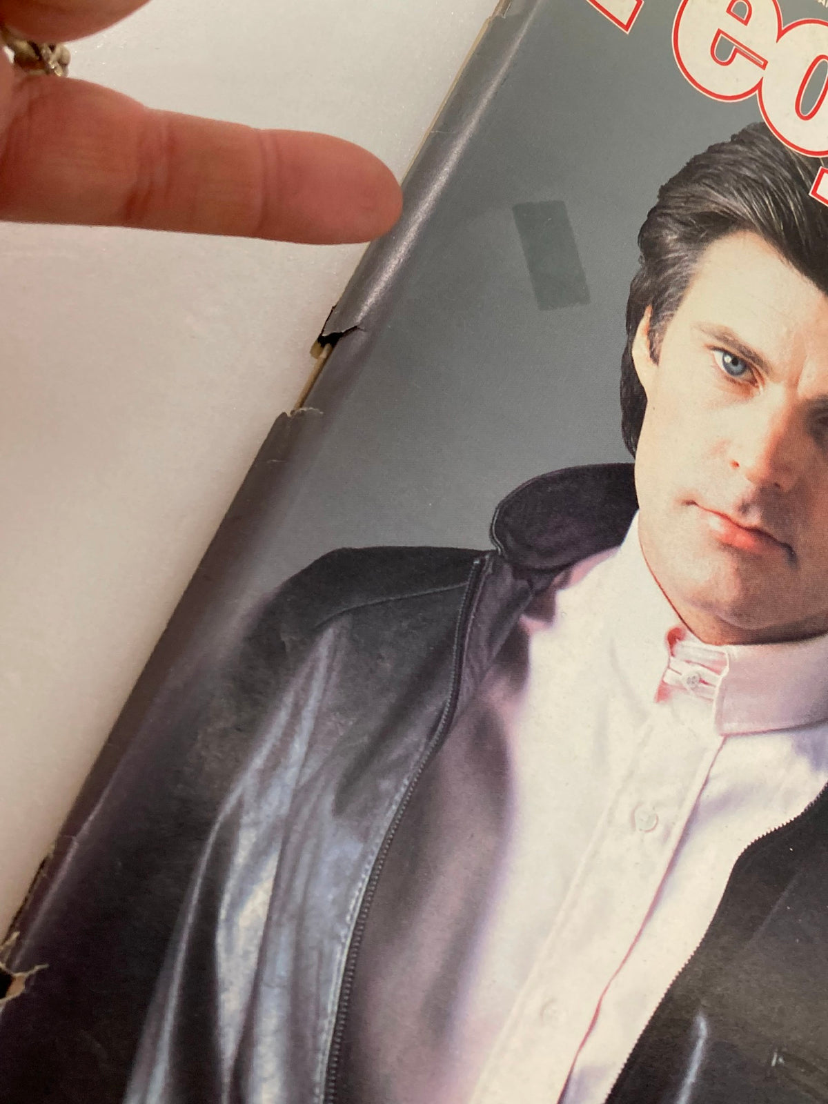 Close-up view of the cover of VTG People Weekly Magazine January 20, 1986 Vol 25 #3, highlighting Ricky Nelson, with visible wear and tear on the magazine's edge.
