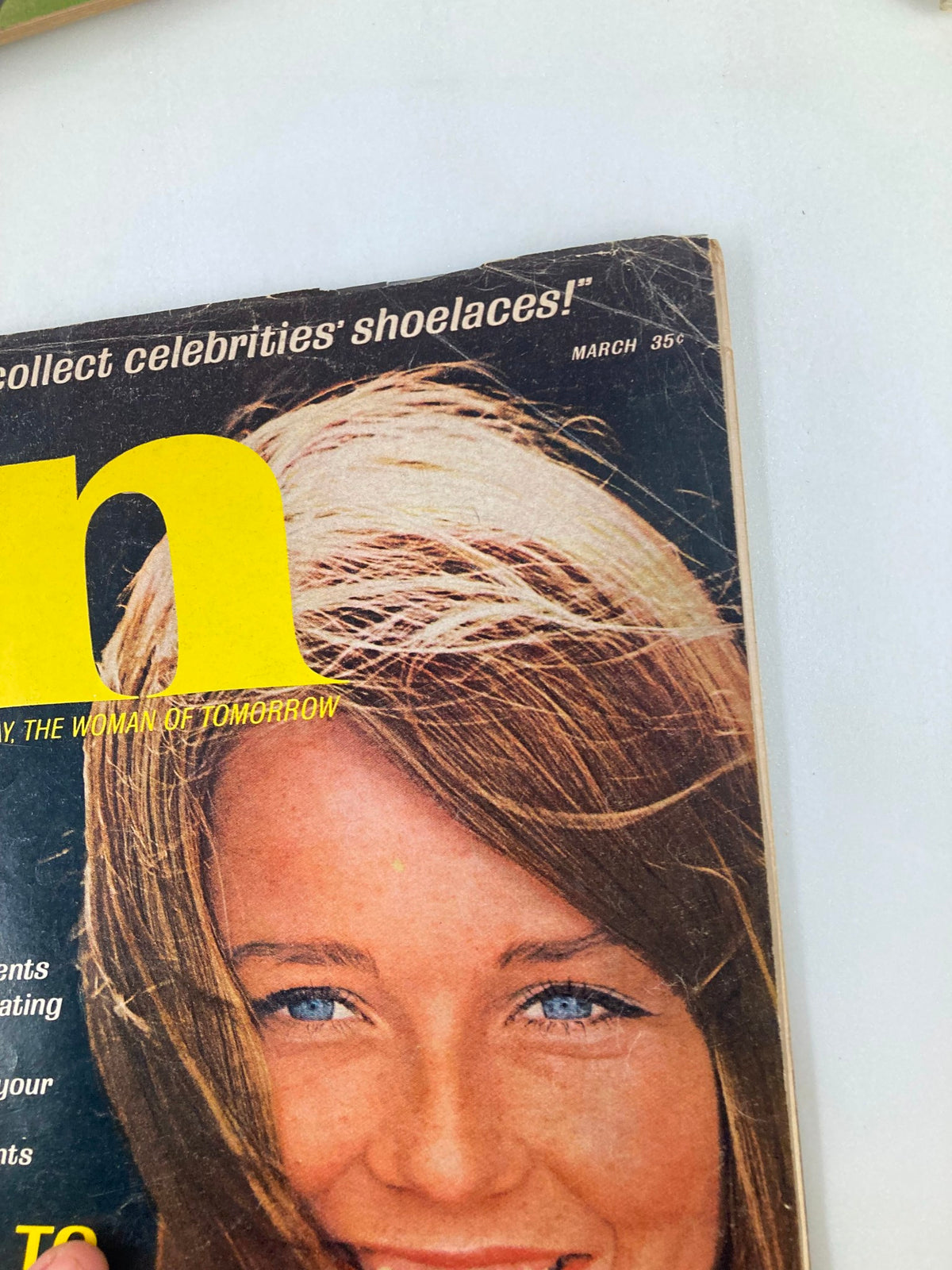 Close-up of the front cover of VTG IN Magazine March 1966 highlighting the magazine's tagline and a smiling woman's face.