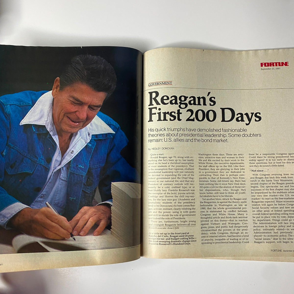 An interior spread from Fortune Magazine, September 21, 1981, featuring Ronald Reagan focused on a document as the article 'Reagan's First 200 Days' discusses his leadership.