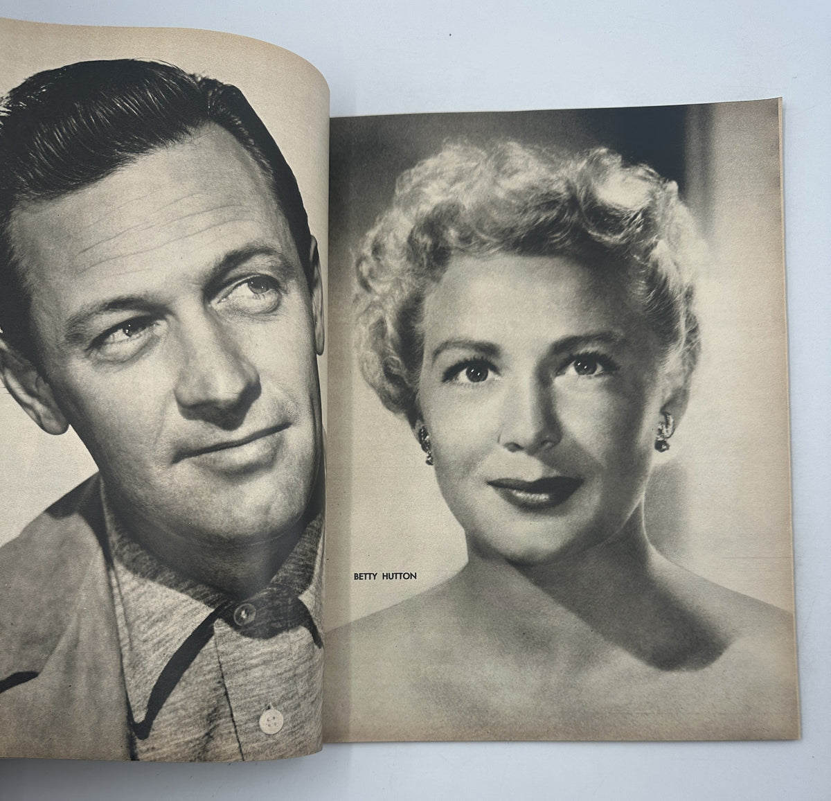 Page from the Photoplay Magazine Annual 1951 featuring close-up photographs of actors Betty Hutton and an unidentified male actor, emphasizing classic Hollywood film star portraits.