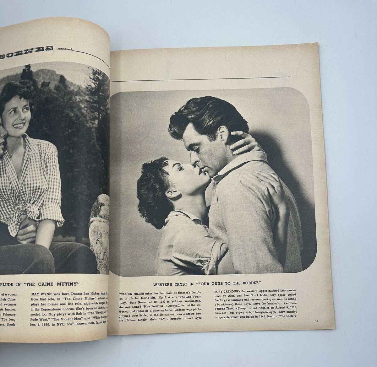 Photoplay Magazine Annual 1955 presenting a romantic scene with actors from classic films, highlighting the cinematic love stories of the era.