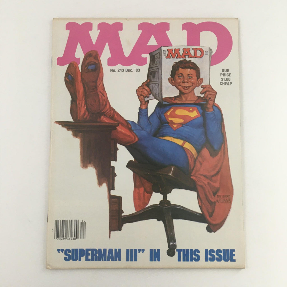 Mad Magazine December 1983 No. 243 featuring a humorous Superman illustration, showcasing the iconic character in a seated position, capturing the comedic essence related to the movie Superman III.