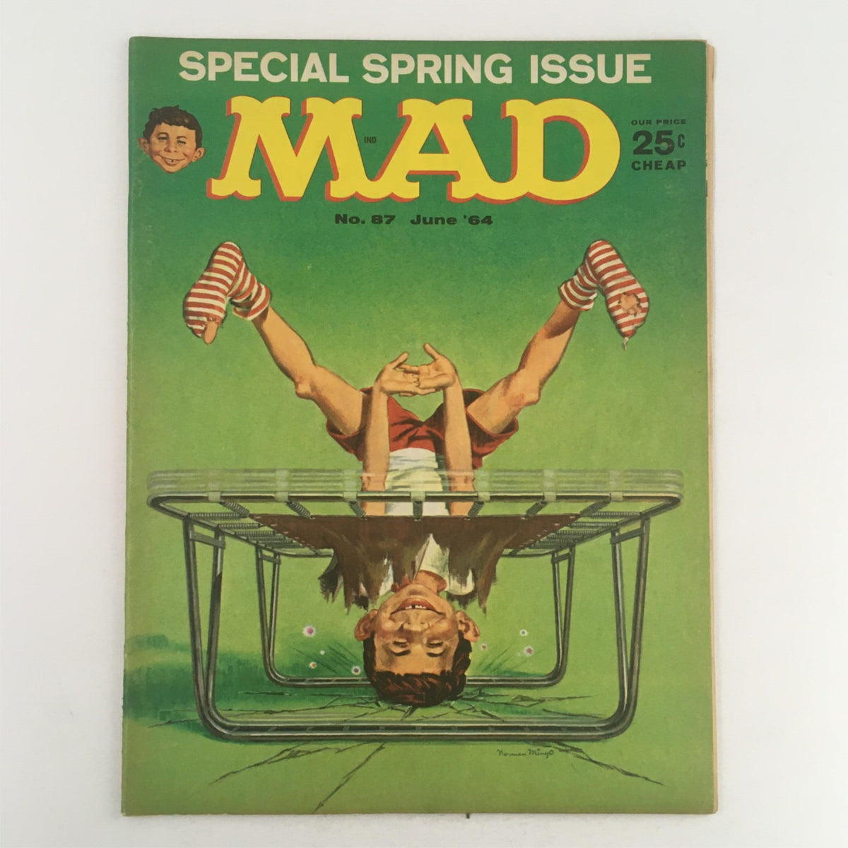 Cover of Mad Magazine June 1964 No. 87 Special Spring Issue featuring whimsical illustration of a boy on a trampoline with a green background. This well-preserved Fine FN 6.0 collectible edition showcases the humorous charm of Mad Magazine.