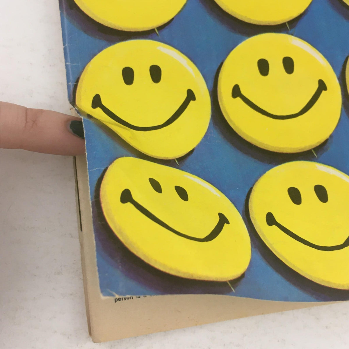 Detailed view of the cover of Mad Magazine April 1972 No. 150, emphasizing the iconic smiley faces and the vintage aesthetic.