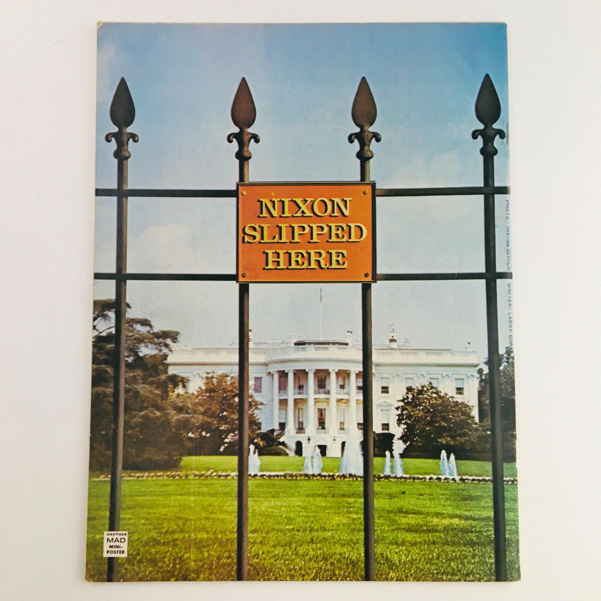 Back cover of Mad Magazine June 1974 No 167 showcasing a photograph of the White House with a sign reading 'Nixon Slipped Here', reflecting satirical commentary of the era.