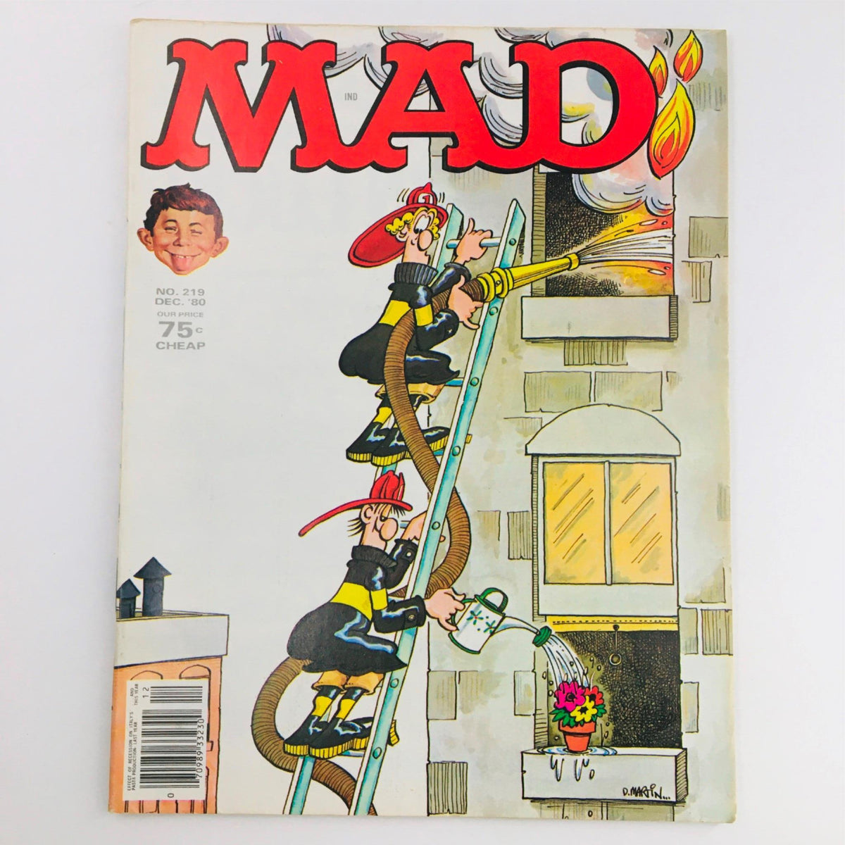 Cover of Mad Magazine December 1980 No. 219 featuring humorous illustration of fire fighters with a water hose and a comical character, graded Fine/FN 6.0.