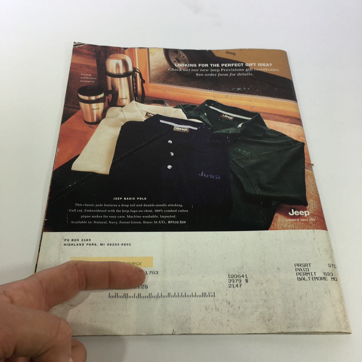 Back cover of the 2000 Jeep Provisions Classic Gear for Jeep Enthusiast brochure Catalog displaying Jeep Basic polo shirts and coffee mugs, along with pricing details and a promotional message.