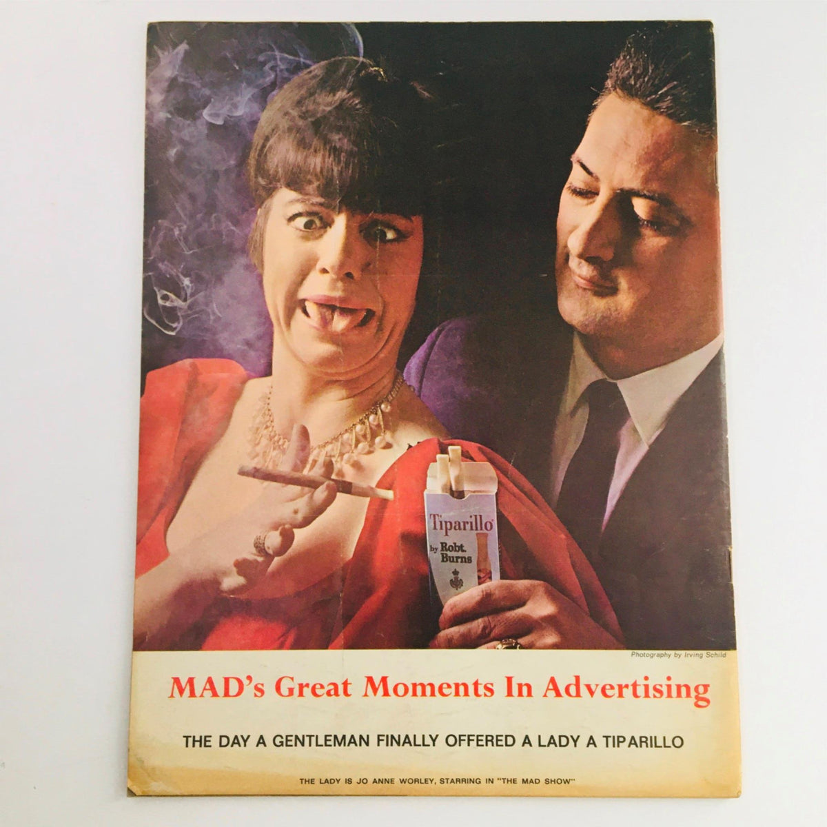 Back cover of Mad Magazine July 1966 No. 104, highlighting a comedic scene titled 'MAD’s Great Moments In Advertising,' featuring a woman making a funny expression while smoking, promoting the product Tiparillo.