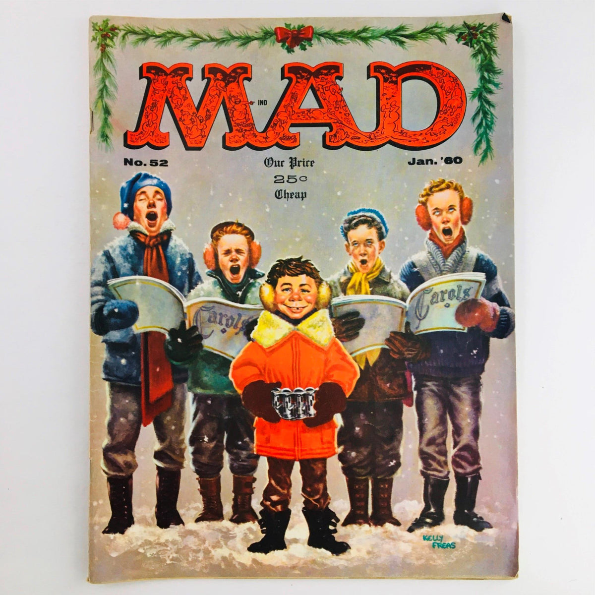 Cover of Mad Magazine January 1960 No. 52 featuring a group of children caroling in winter attire, capturing the holiday spirit with humor and nostalgia.