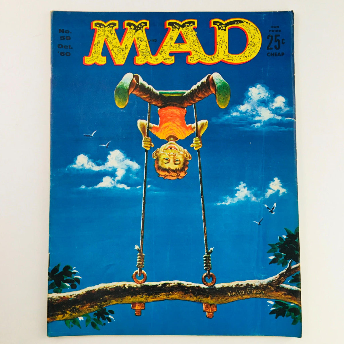 Mad Magazine October 1960 No. 58 cover featuring a whimsical illustration of a boy swinging upside down, showcasing vibrant colors and a playful design.