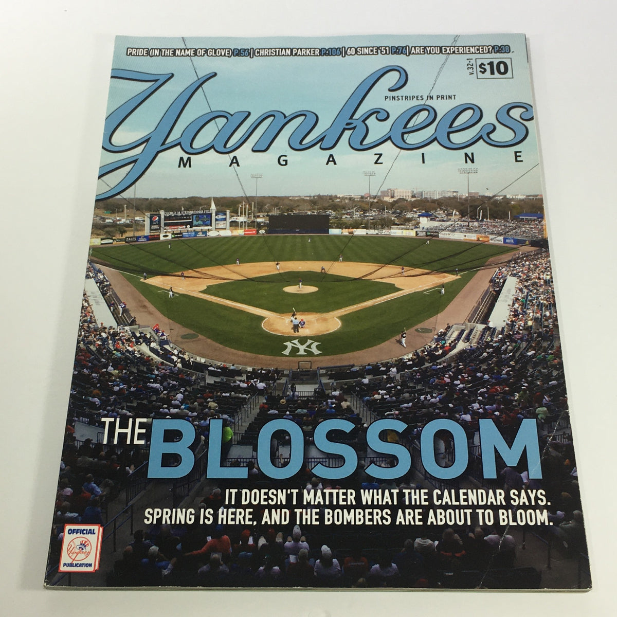 Cover of Yankees Magazine Spring 2011 Volume #32-1 featuring 'The Blossom' theme, showcasing a baseball field with players on the field and the caption highlighting the arrival of spring in baseball.