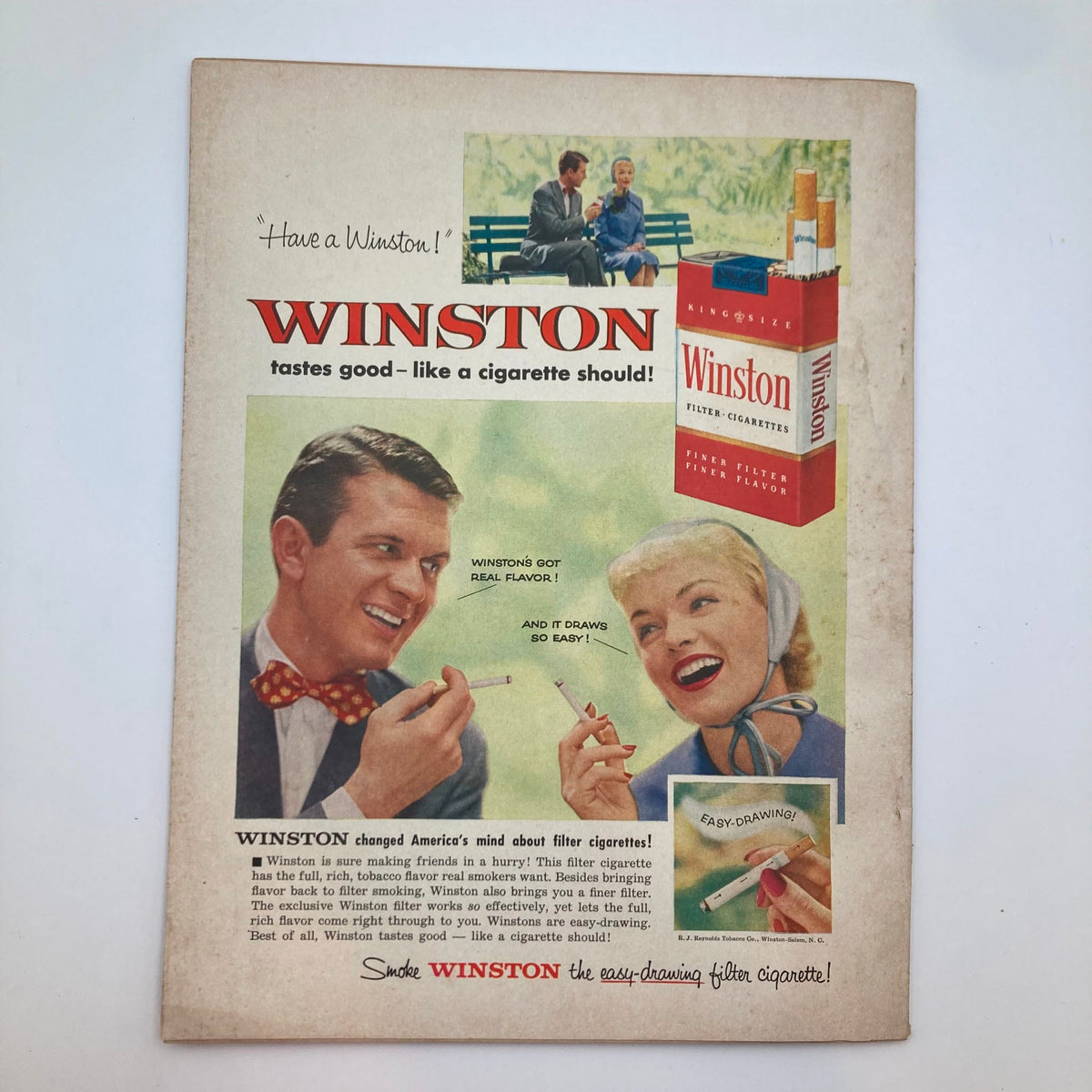VTG Everywoman's Magazine July 1955 advertisement for Winston cigarettes featuring a couple enjoying their time, emphasizing the product's appeal in the mid-20th century.