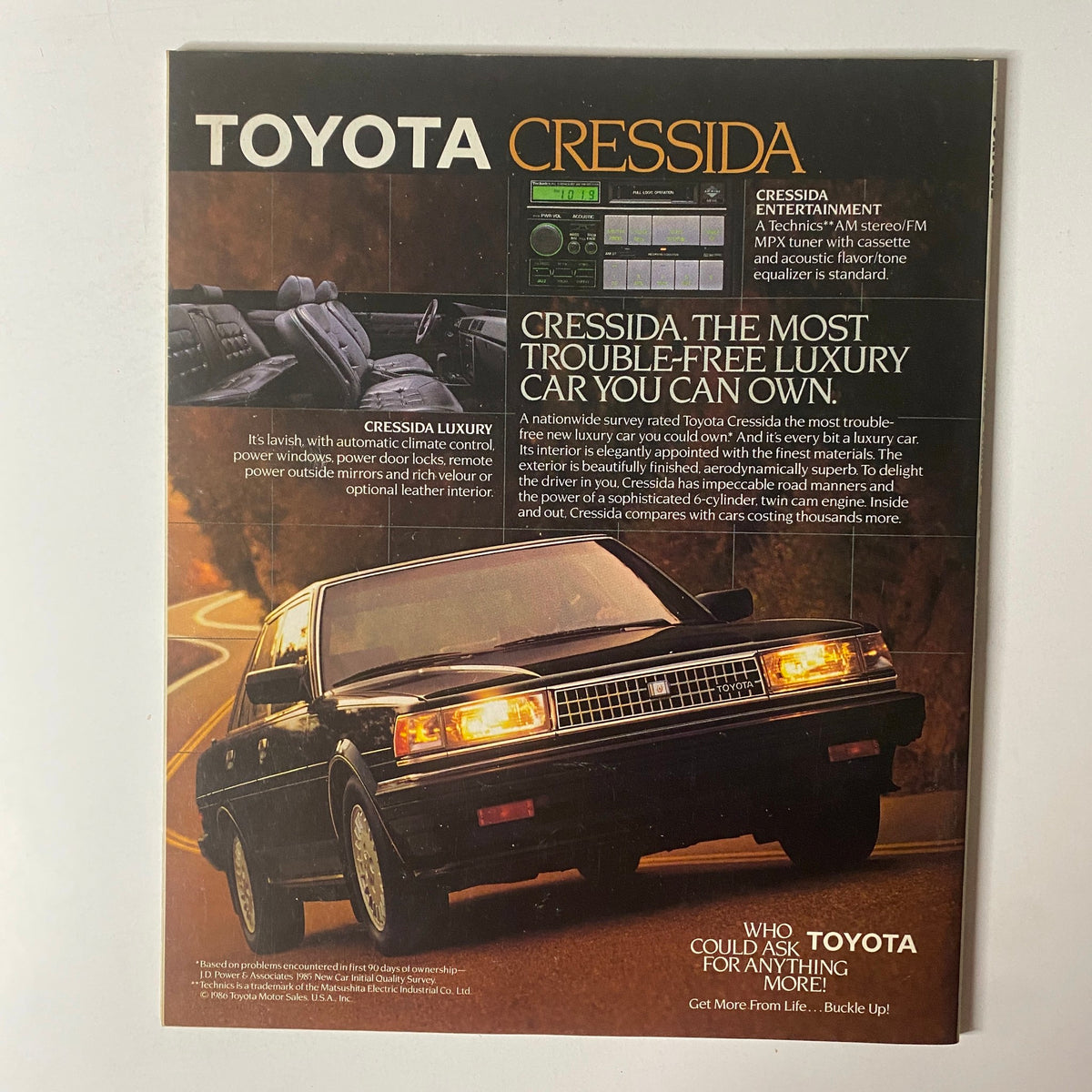 Fortune Magazine February 16, 1987 featuring a vintage advertisement for the Toyota Cressida. The ad highlights the luxury features and trouble-free reputation of the Cressida, showcasing its elegant design, dashboard entertainment system, and comfortable interior.
