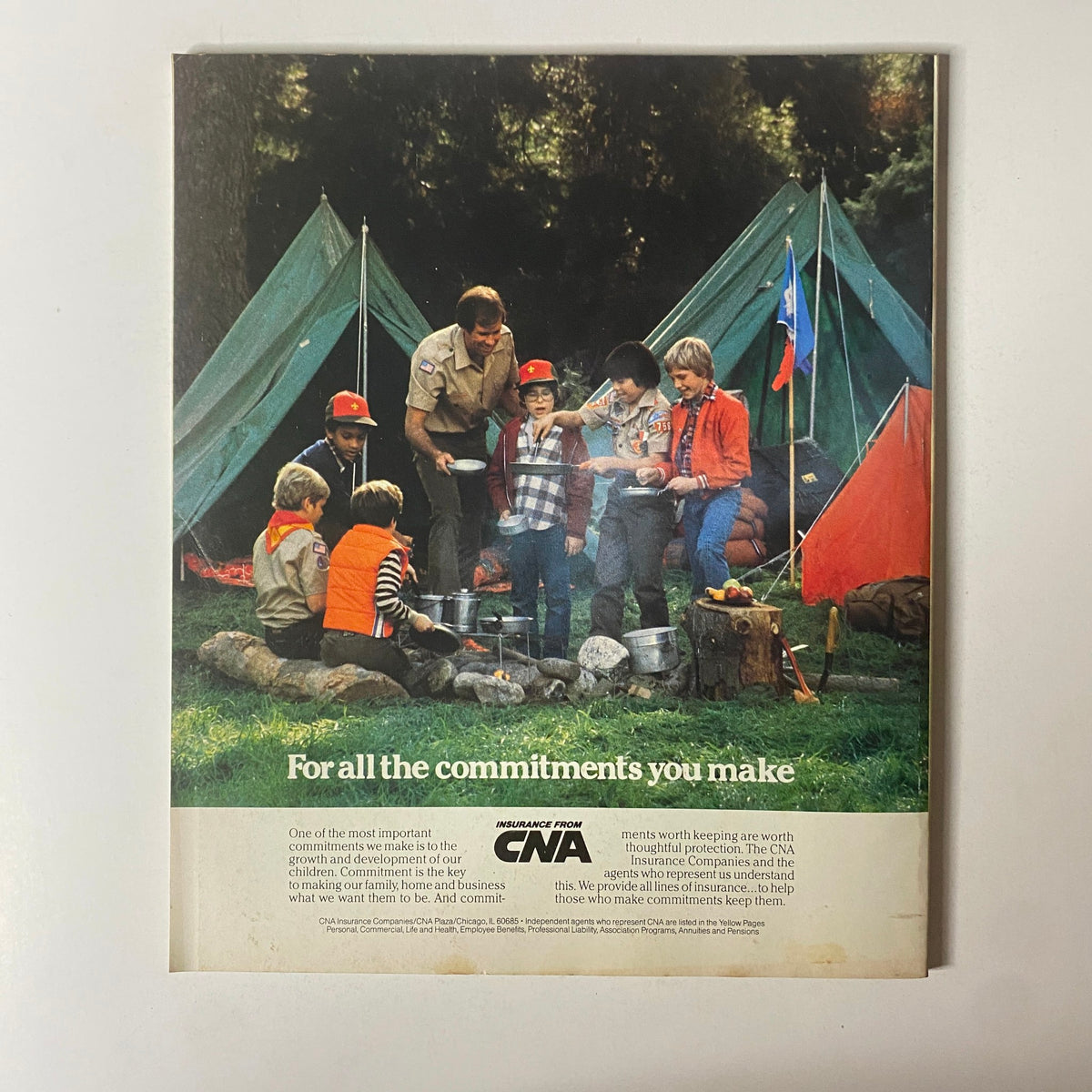 Back cover of Fortune Magazine September 5, 1983, featuring a colorful camping scene with children and adults, along with an advertisement for CNA Insurance.