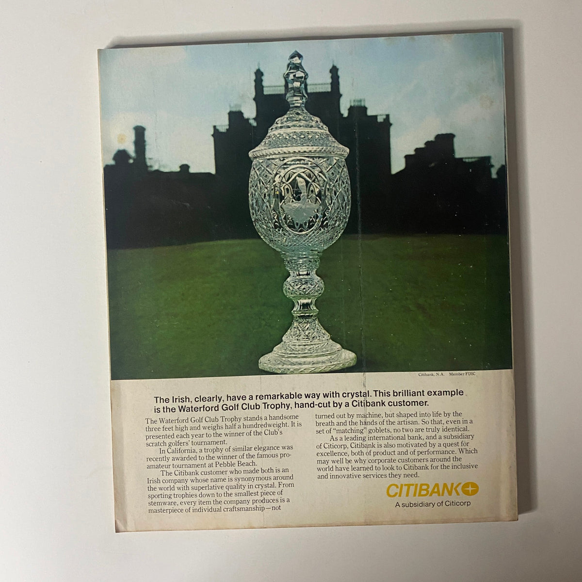Back cover of Fortune Magazine December 1977 showcasing the Waterford Golf Club Trophy, highlighting the craftsmanship of crystal and the influence of Citibank in the business world, aligned with the magazine's theme on the theme park business.