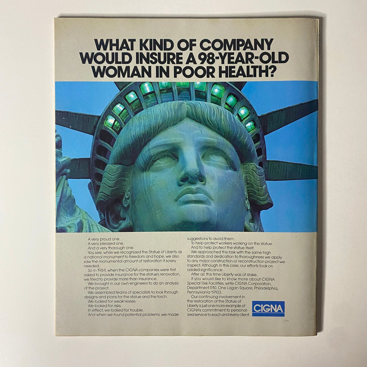 Fortune Magazine September 1, 1986 includes a CIGNA advertisement depicting the Statue of Liberty, posing the question, 'What kind of company would insure a 98-year-old woman in poor health?' highlighting their commitment to risk management.