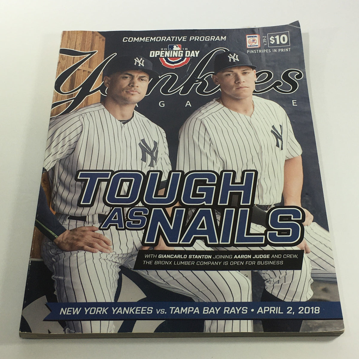 Cover of Yankees Magazine: April 2 2018 Volume #39-2 featuring Giancarlo Stanton and Aaron Judge, highlighting the opening day matchup between New York Yankees and Tampa Bay Rays with the title 'TOUGH AS NAILS'.