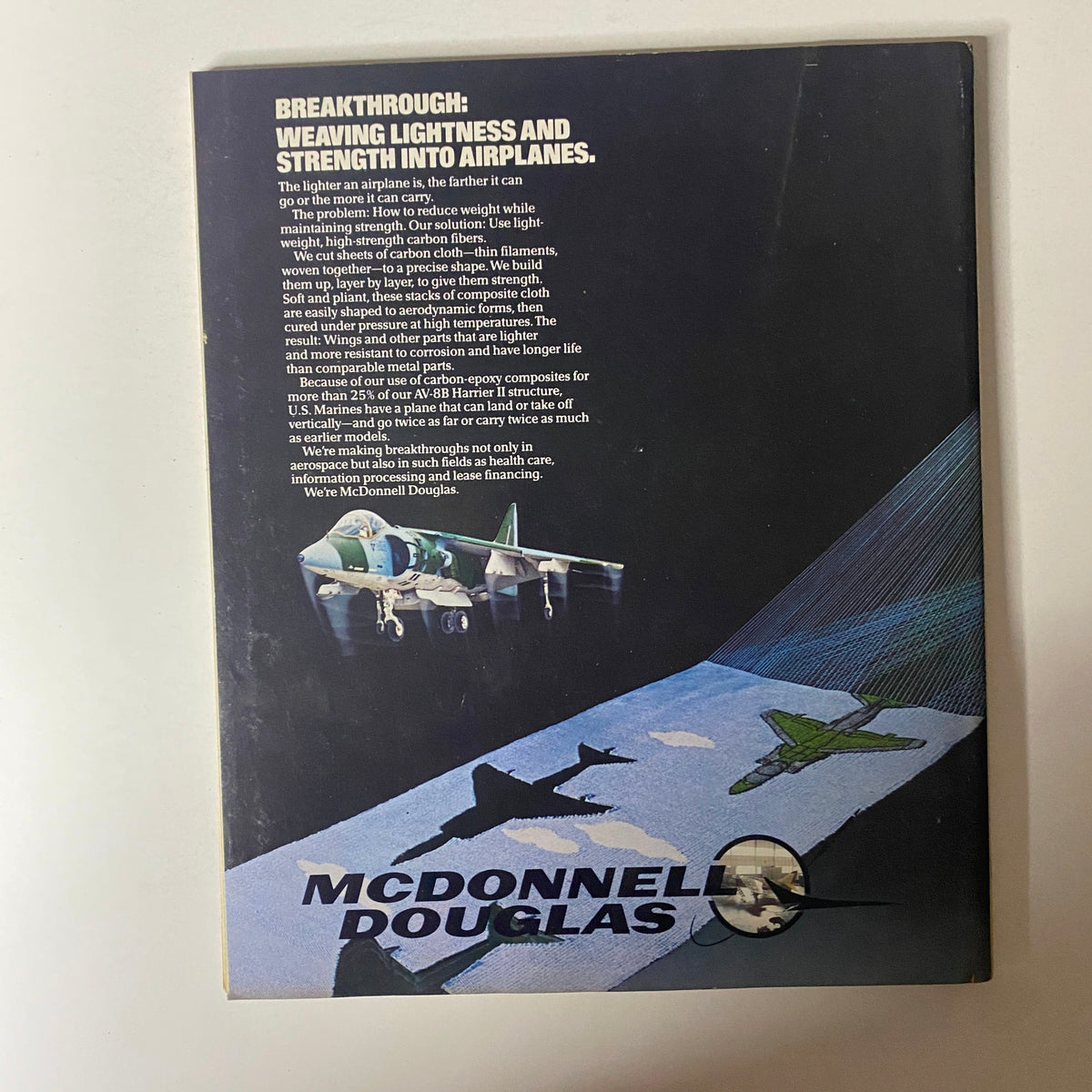 Back cover of Fortune Magazine September 16, 1985, presenting an advertisement by McDonnell Douglas about innovations in airplane materials. The text highlights the benefits of using lightweight carbon fibers in aerospace technology.