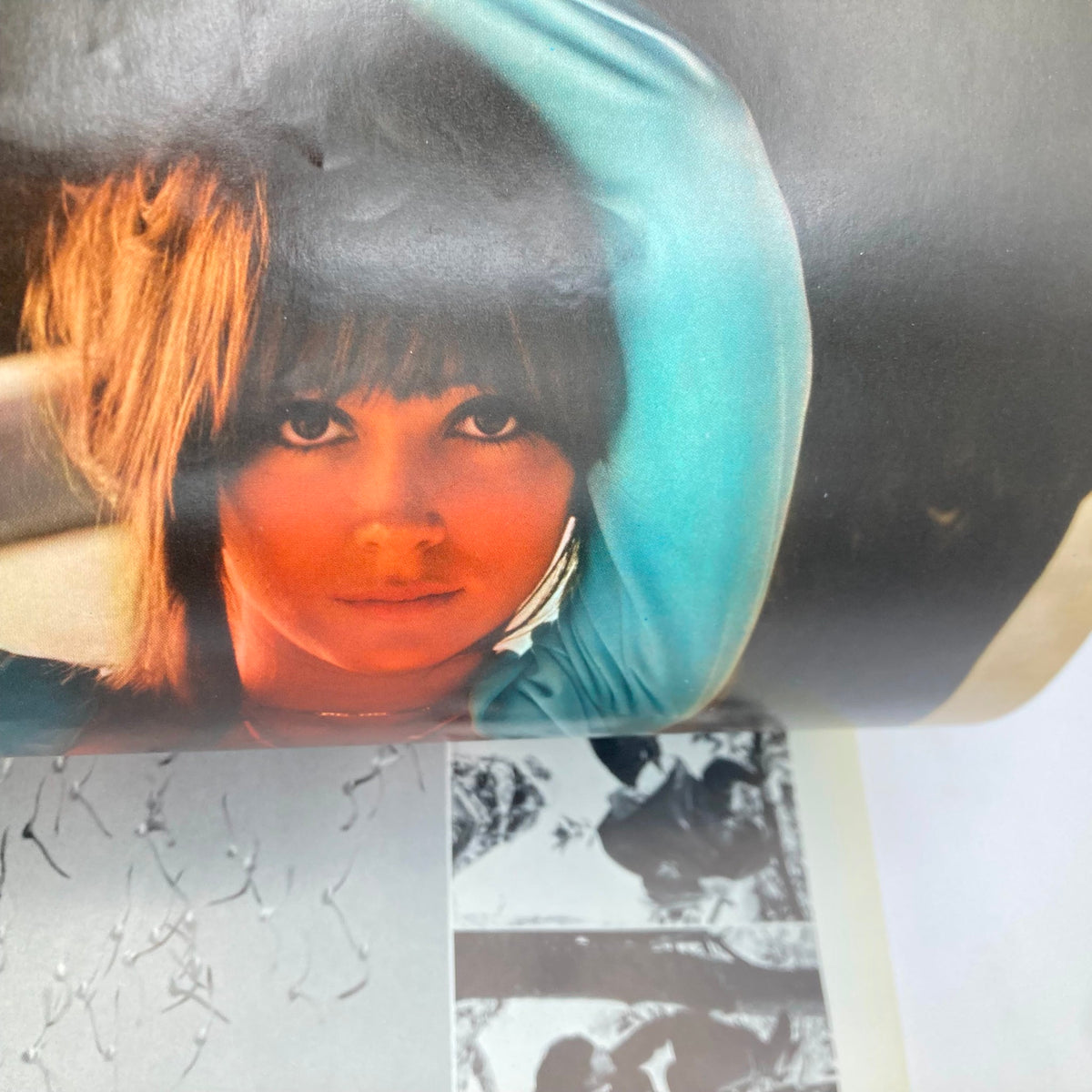 Inside page of the Vintage Playboy Magazine August 1969 showcasing a striking photograph of a model with dramatic eye makeup and a unique hairstyle.