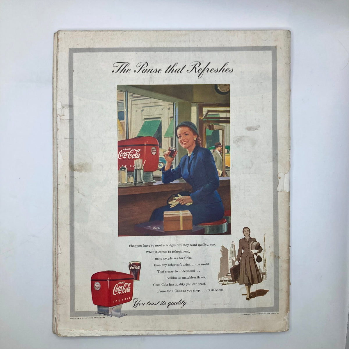 Back cover of Saturday Evening Post Magazine from October 31, 1953, featuring a Coca-Cola advertisement, depicting a woman enjoying a soda at a diner, highlighting vintage marketing style.