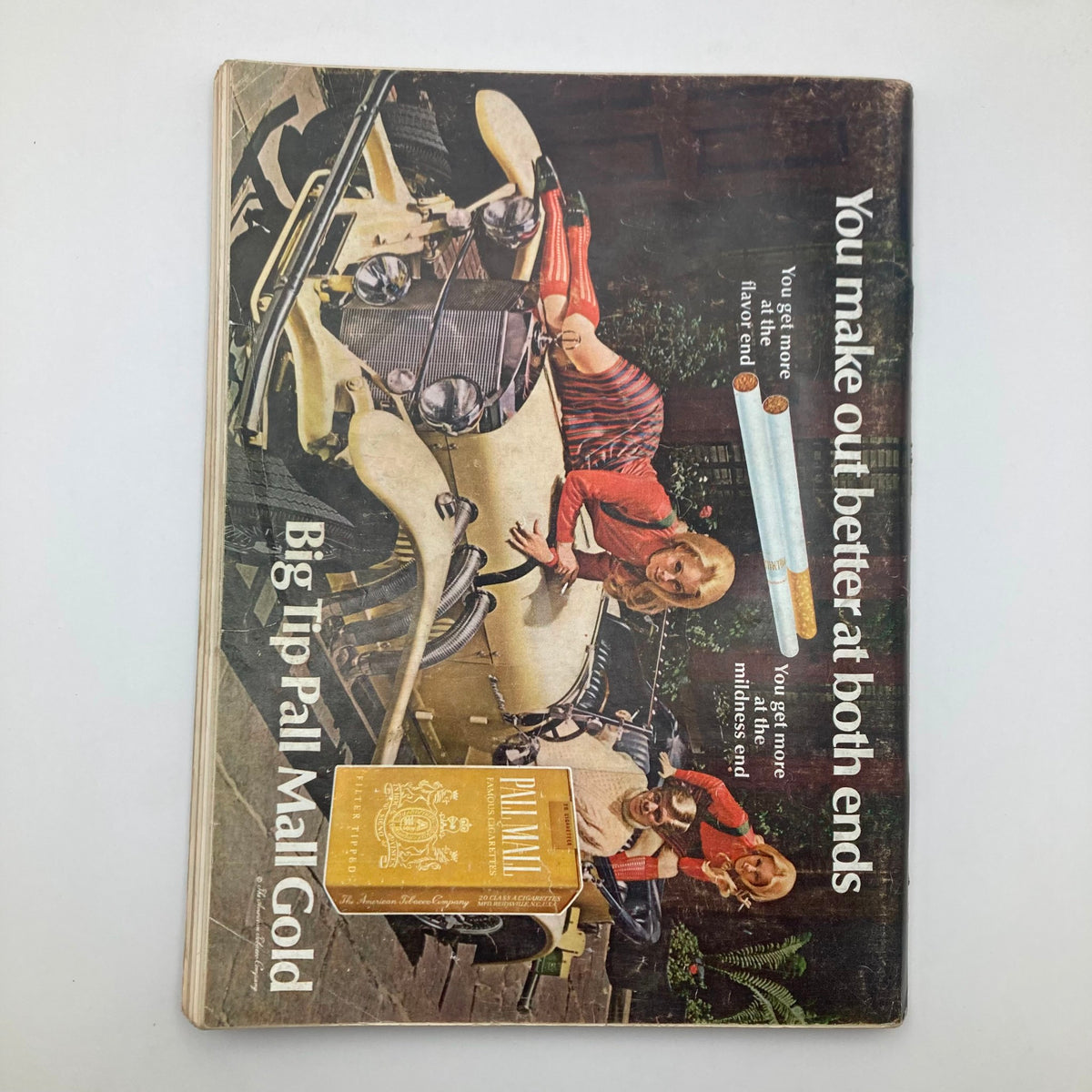 Back cover of the Vintage Playboy Magazine November 1968, featuring a vintage advertisement with two models and a car, capturing the nostalgic advertisement style of the period.